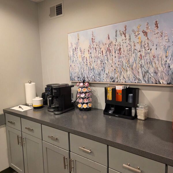 Office breakroom coffee station wiped down and organized
