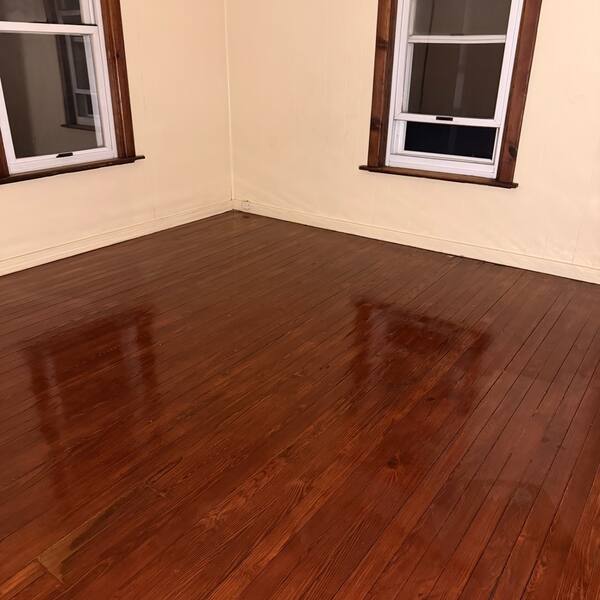Hardwood floor freshly mopped and gleaming
