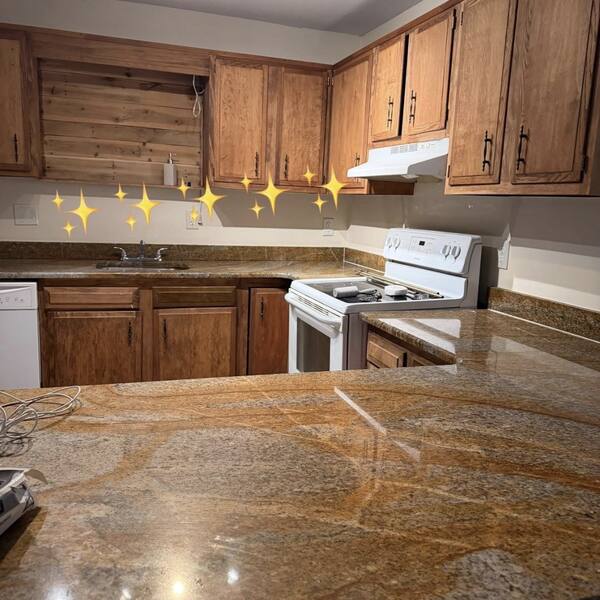 Granite kitchen counter and cabinets cleaned by A1 Supreme