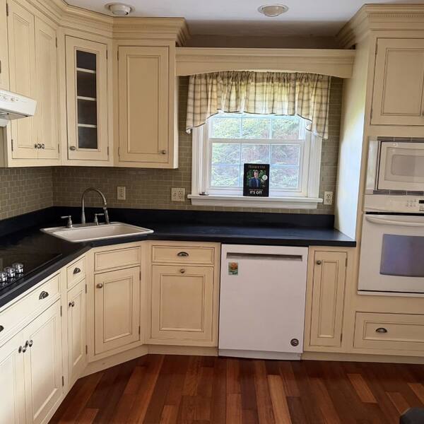 Cream cabinet kitchen with polished countertops