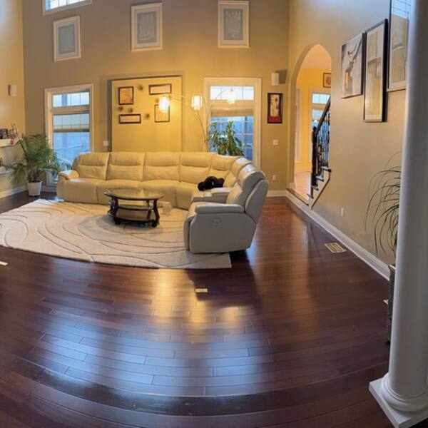 Spacious living room with hardwood floors freshly cleaned