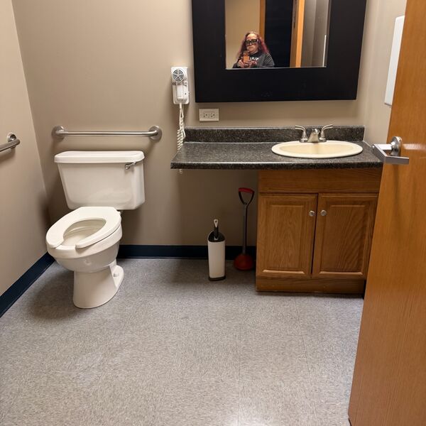 Commercial office bathroom cleaned and sanitized
