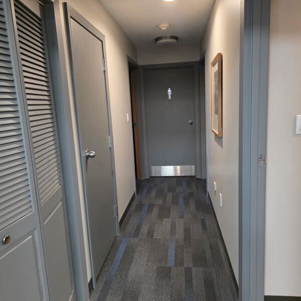 Commercial office hallway with carpet freshly vacuumed