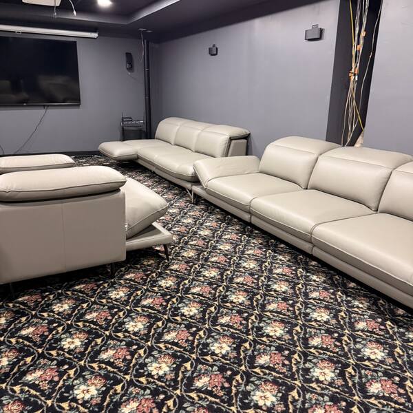 Home theater room with carpet vacuumed and sofas cleaned