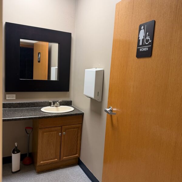 Women's commercial restroom cleaned and sanitized